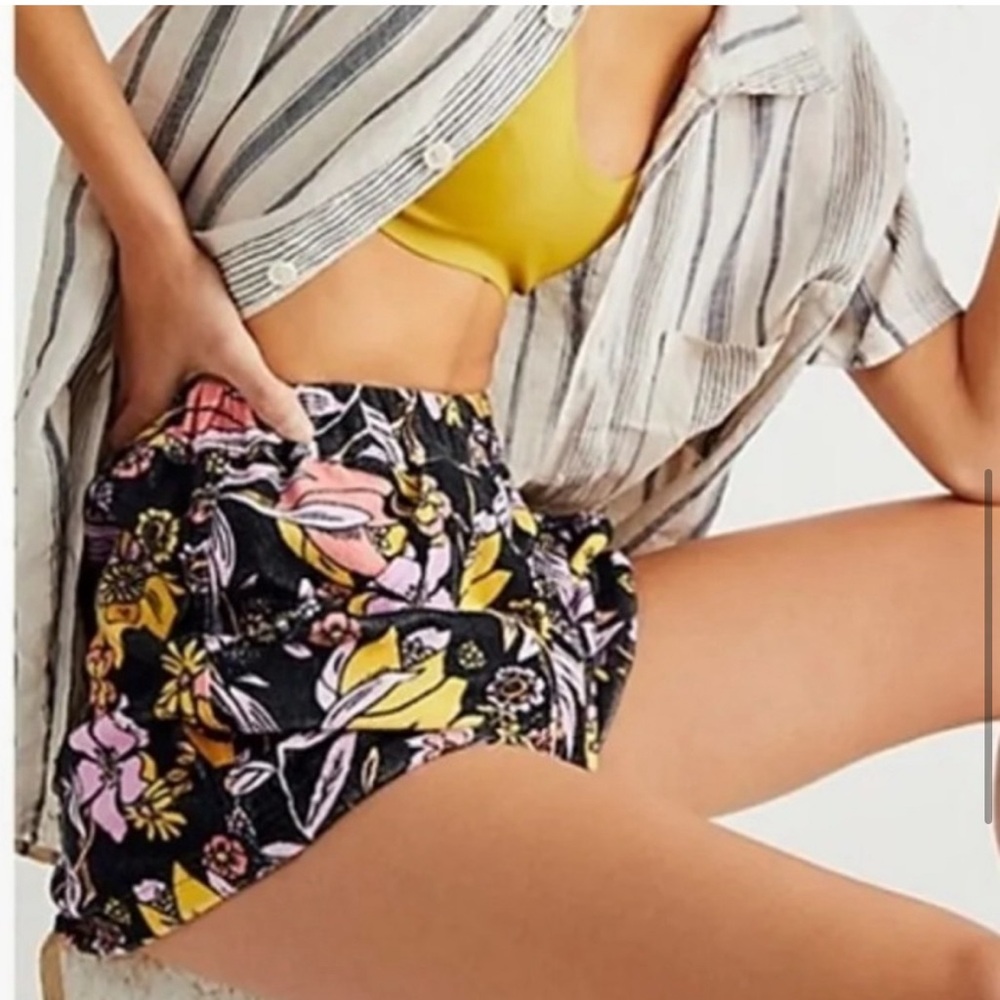 Pre-loved Free People black floral shorts.